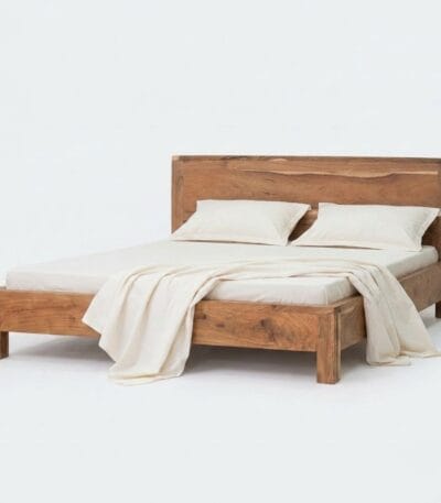 Ota acacia wood bed with a minimalist platform frame in a natural texture finish
