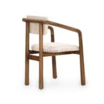 Side view of the Taki dining chair showing the padded backrest and oak frame