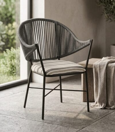 Curve outdoor chair with striped cushion in a garden-facing living space