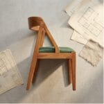 Ela wooden dining chair side view showing the angled A-frame back