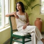 Goa dining chair with printed seat cushion in a plant-filled room