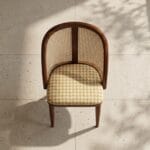 Kaen cane dining chair front view showing the barrel backrest