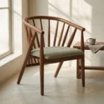 Pickle spindle-back dining armchair beside a window with a side table