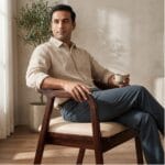Guest seated on the Rena wooden dining armchair