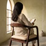 Rena dining armchair in a reading corner with natural light