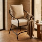 Ross outdoor arm chair with a throw draped over the arm