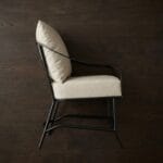 Ross outdoor arm chair side profile against a dark backdrop