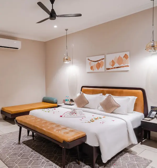 Maira Resort Family Suite with solid wood bed, upholstered headboard, day bed and coordinated bedroom furniture.