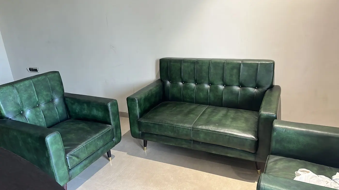 Green upholstered seating installed for a Maira Resort interior.